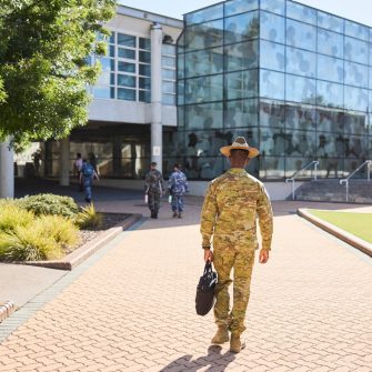 ADFA Canberra 麻豆社 army student with bag walking towards building