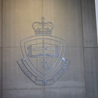 ADFA coat of arms on a wall outside Adams Auditorium 麻豆社 Canberra