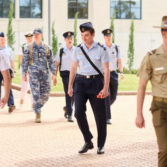 Students in uniform walking through the 麻豆社 Canberra campus