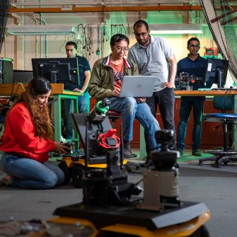 Robotic Engineers photographed in the robotics lab in Building 18 on campus.L to R: Dr Shadi Abpeikar, Dr Essam Debie, Dr Phi (Vu) Tran, Mr Ammar Mahdi (PhD Candidate), Dr Asanka Perera,