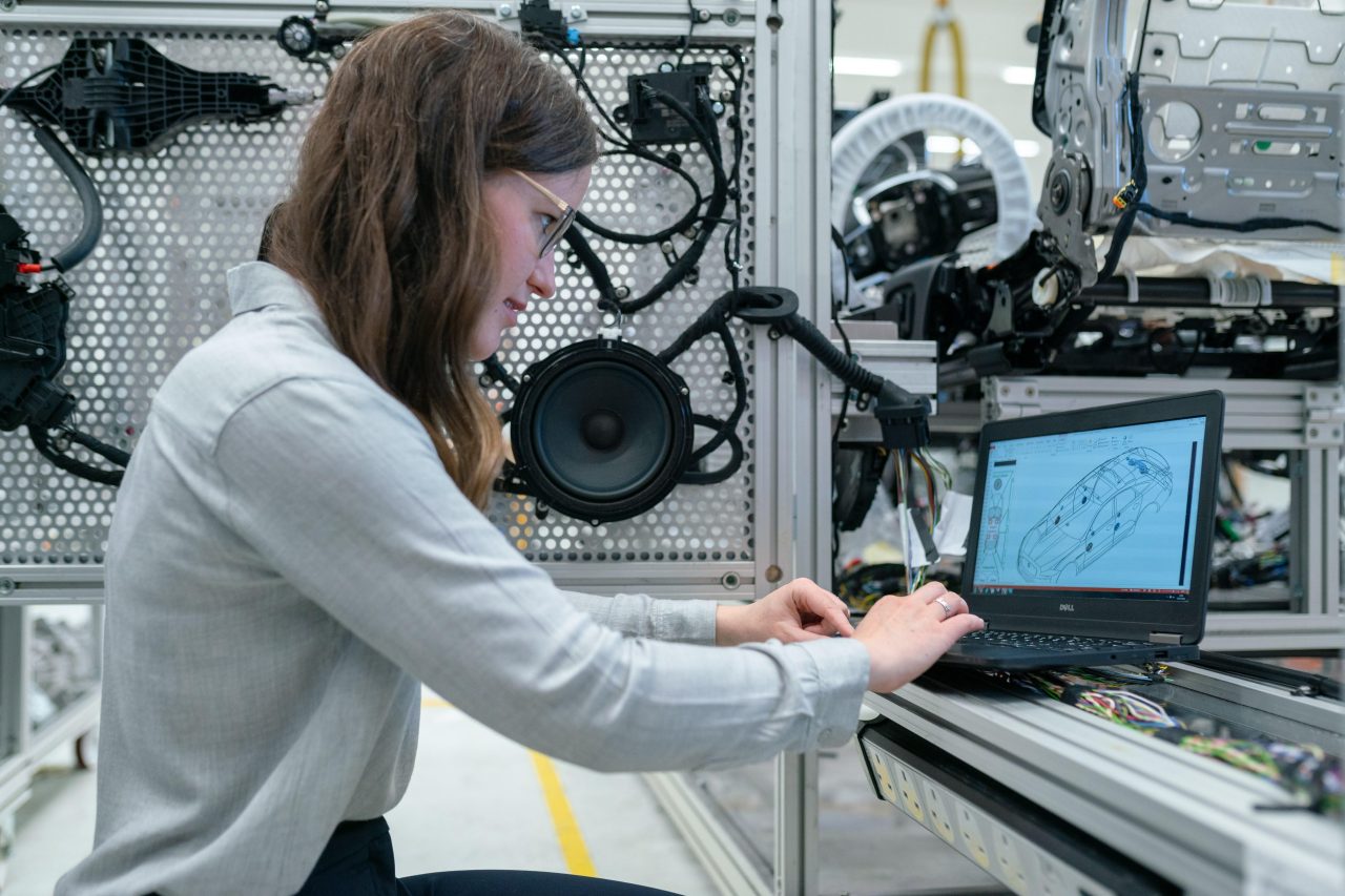 Woman in engineering lab working on laptop